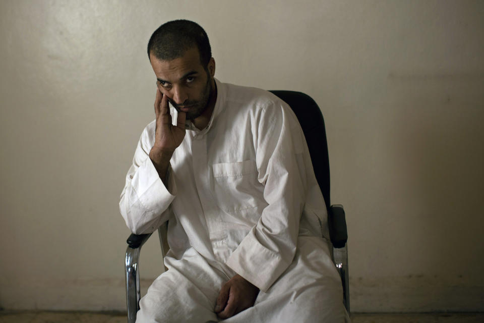 In this Sept. 4, 2019 photo, Abu Adel al-Jazrawi, a Saudi national in Kurdish detention who worked in the Islamic State group's War Spoils departments, which regulated the sale of Yazidi slaves among other things, pauses during an interview in Rmeilan, northeast Syria. Al-Jazrawi put it bluntly: "Slaves were just the means for high officials to get rich," he told The Associated Press. (AP Photo/Maya Alleruzzo)