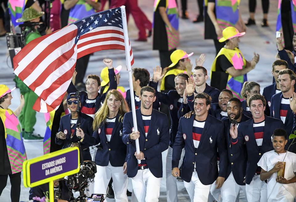 <p>He’s the most decorated Olympian of all time and the first U.S. male swimmer to compete in five Games — and it’s the first time he’s ever been able to walk in the Parade of Nations at an Opening Ceremony. This was the perfect start to his final Olympics, perhaps the first he’s been relaxed enough to truly experience and enjoy (even if his special jacket failed to shine). (David Eulitt/Kansas City Star/TNS via Getty Images) </p>