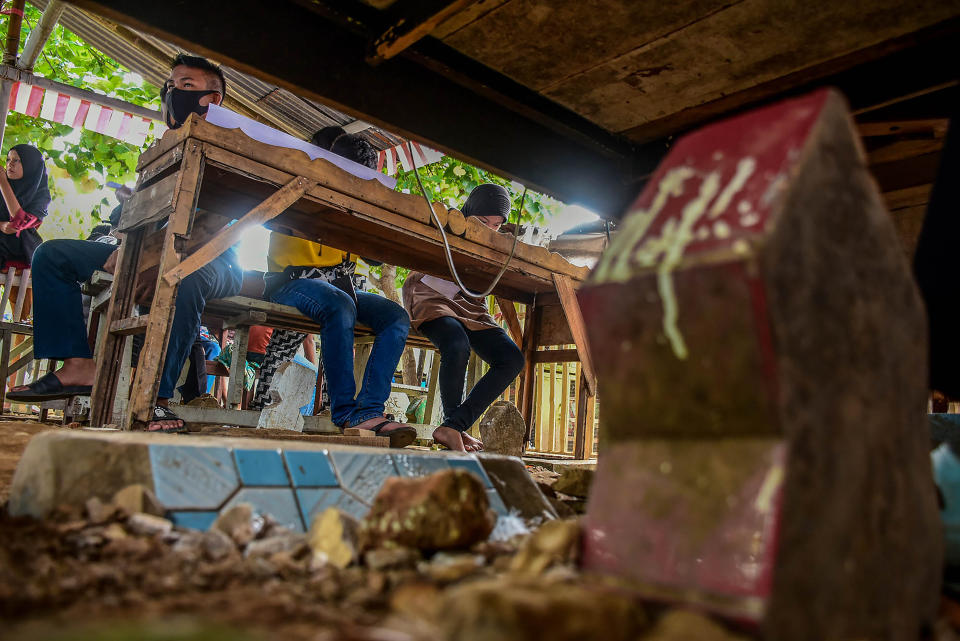 A number of children study in emergency schools built in Makassar, Indonesia. This school was established by residents to help children who have difficulties in learning during the coronavirus pandemic. 