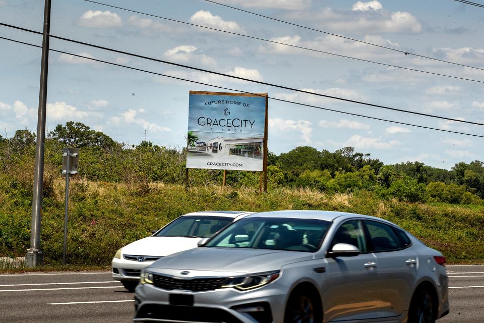 A sign on Bartow Road announces plans for the new Grace City Church site just north of Highland City.