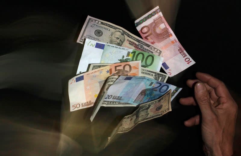 Euro and U.S. dollar banknotes are seen in this picture illustration taken in Prague