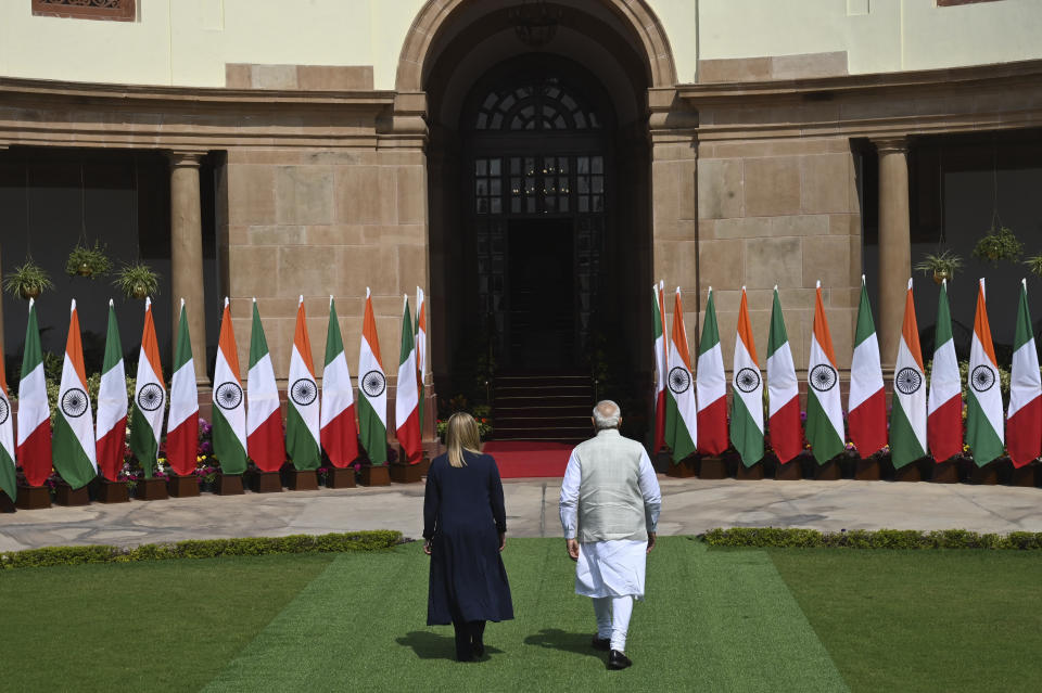 Italian Premier Giorgia Meloni, left, and Indian Prime Minister Narendra Modi, leave for their meeting after posing for the media in New Delhi, India, Thursday, March 2, 2023. (AP Photo)