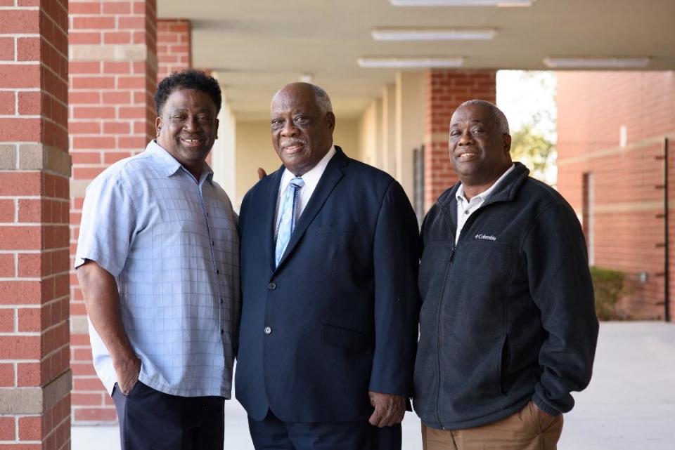 Charles, David and Tony Anderson pose for a photo at Dr. David L. Anderson Middle School in Martin County.