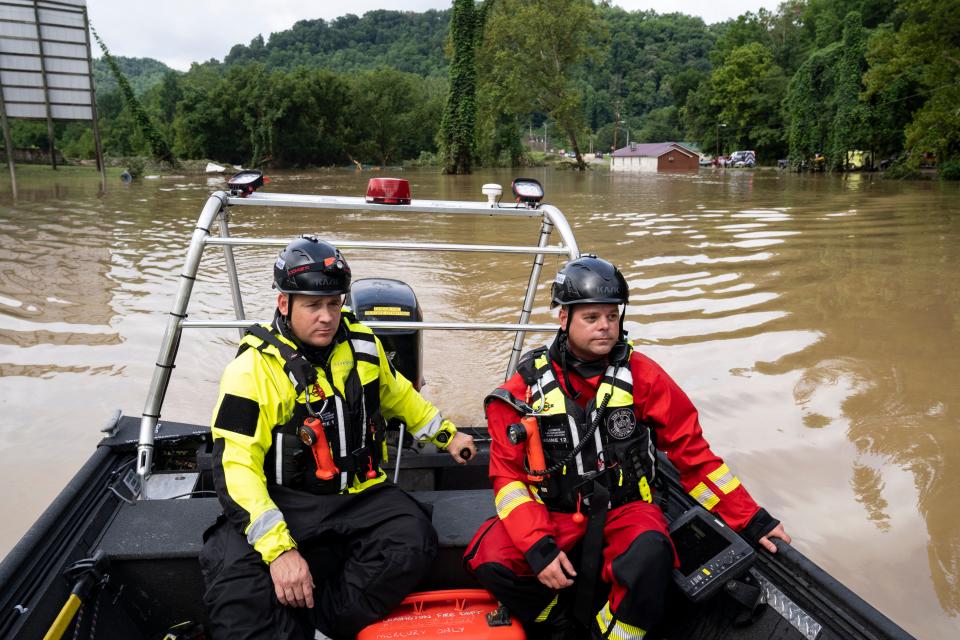 Firefighters from Lexington, Kentucky head out to look for people in Lost Creek, Kentucky on Friday (Getty Images)