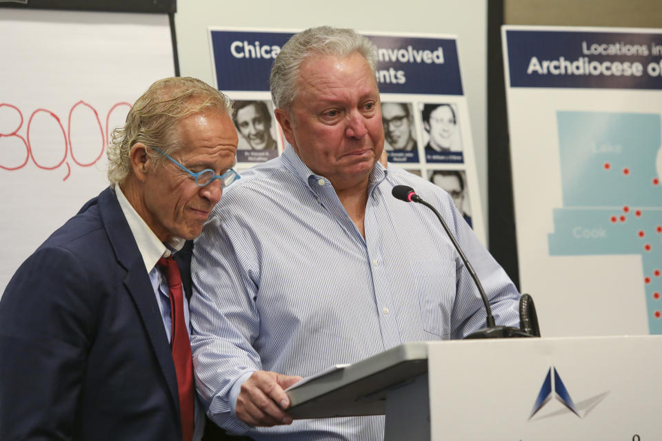 Jeff Anderson, an attorney for victims of sexual abuse by clergy, is joined by abuse victim Joe Iacono as he speaks during a press conference in Chicago, Sept. 17, 2019. Anderson says the Roman Catholic Archdiocese of Chicago has paid $80 million in settlements to clients represented by his law firm alone since 2000. Anderson told reporters in Chicago Tuesday, Sept. 17, 2019 it's the first time he's publicly revealed a total sum of payments to 160 survivors by nearly 50 abusers over 20 years. The Minnesota-based lawyer says the payments averaged $500,000 per victim, with some payouts running into the millions of dollars. (AP Photo/Teresa Crawford)