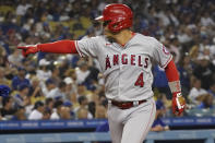 Los Angeles Angels' Jose Iglesias celebrates his solo home near the plate during the fifth inning of the team's baseball game against the Los Angeles Dodgers on Friday, Aug. 6, 2021, in Los Angeles. (AP Photo/Marcio Jose Sanchez)