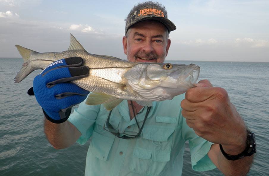 Former Ledger photographer Michael Wilson produced a weekly fishing guide for years. He died Sunday at age 61.