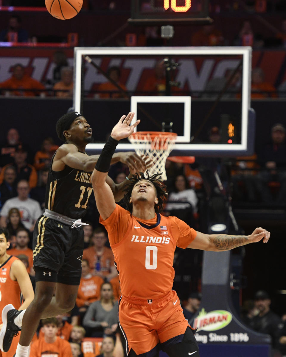 Illinois' Terrence Shannon Jr. (0) tips the ball away from Lindenwood's Kevin Caldwell Jr. during the first half of an NCAA college basketball game, Friday, Nov. 25, 2022, in Champaign, Ill. (AP Photo/Michael Allio)
