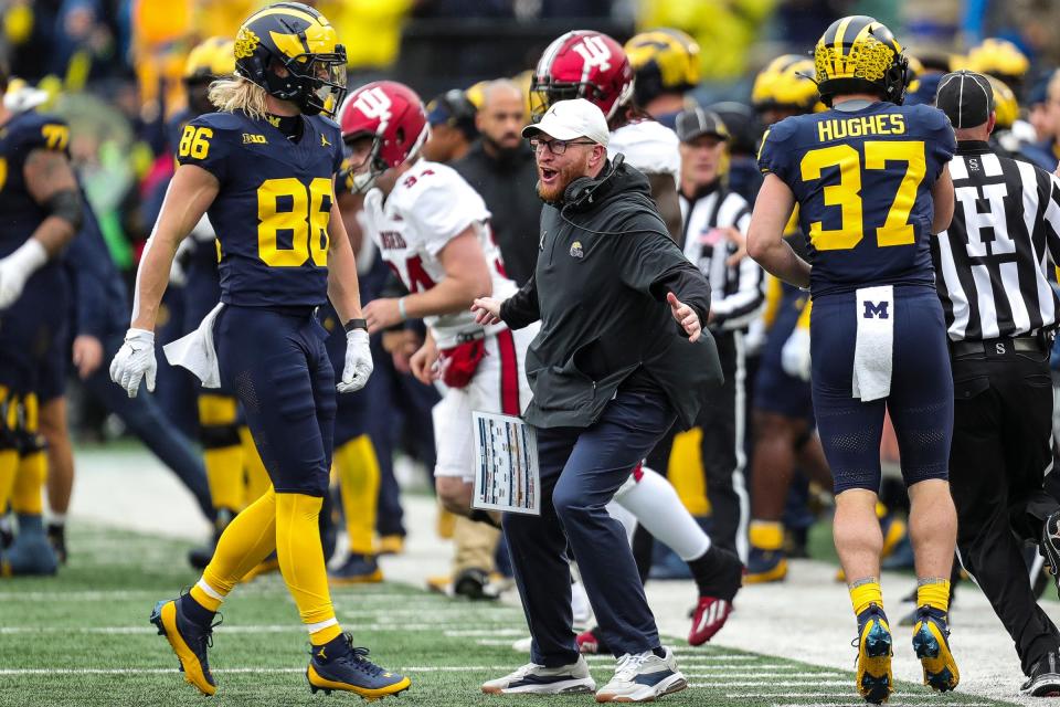 Michigan special team coordinator Jay Harbaugh celebrates a play against Indiana during the first half of U-M's 52-7 win over Indiana on Saturday, Oct. 14, 2023, in Ann Arbor.