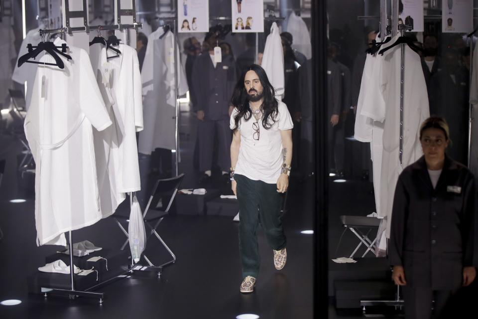 Designer Alessandro Michele walks out at the end of Gucci's Fall/Winter 2020/2021 collection, presented in Milan, Italy, Wednesday, Feb. 19, 2020. (AP Photo/Luca Bruno)