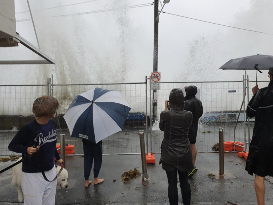 Pictured is the waves crashing on Manly's Fairy Bower, with the waves coming on to the footpath. Source: Twitter/@DocHarleyMD