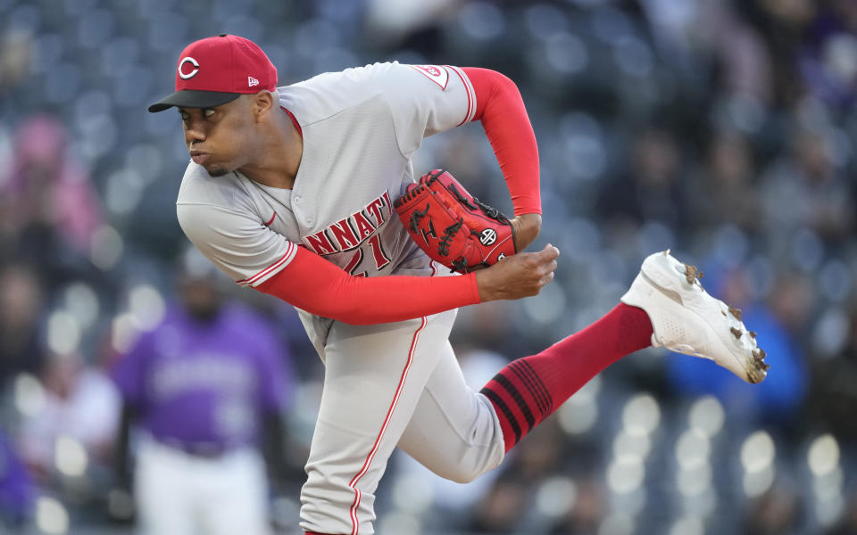 Cincinnati Reds starting pitcher Hunter Greene works against the Colorado Rockies during the first inning of a baseball game Friday, April 29, 2022, in Denver. (AP Photo/David Zalubowski)