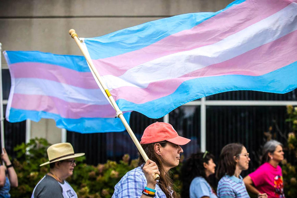 A woman attends a rally in support of trans youth in schools  (Ryan C. Hermens / Lexington Herald-Leader via Getty Images file)