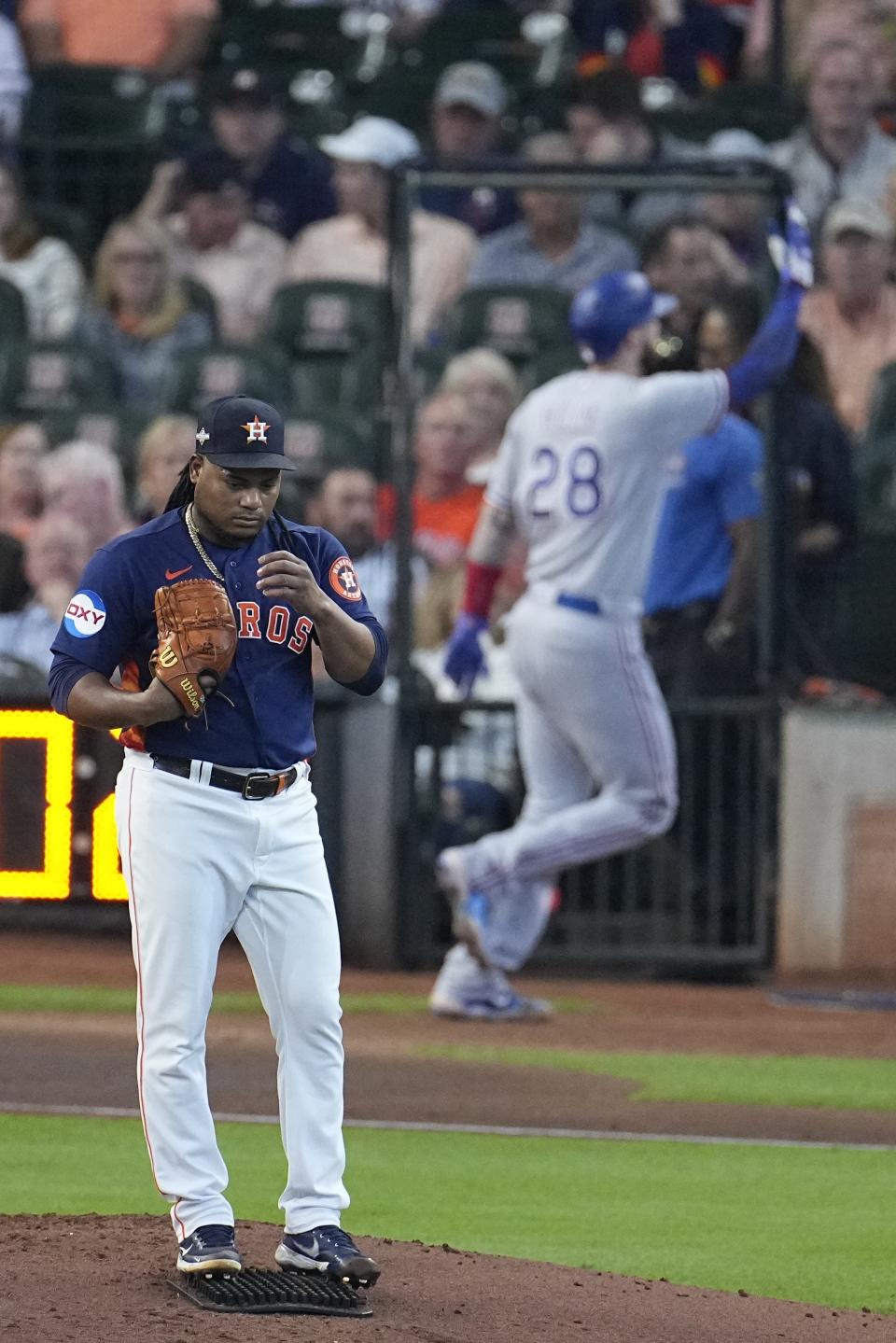 Houston Astros starting pitcher Framber Valdez reacts fater giving up a home run to Texas Rangers' Jonah Heim (28) during the third inning of Game 2 of the baseball AL Championship Series Monday, Oct. 16, 2023, in Houston. (AP Photo/Tony Gutierrez)