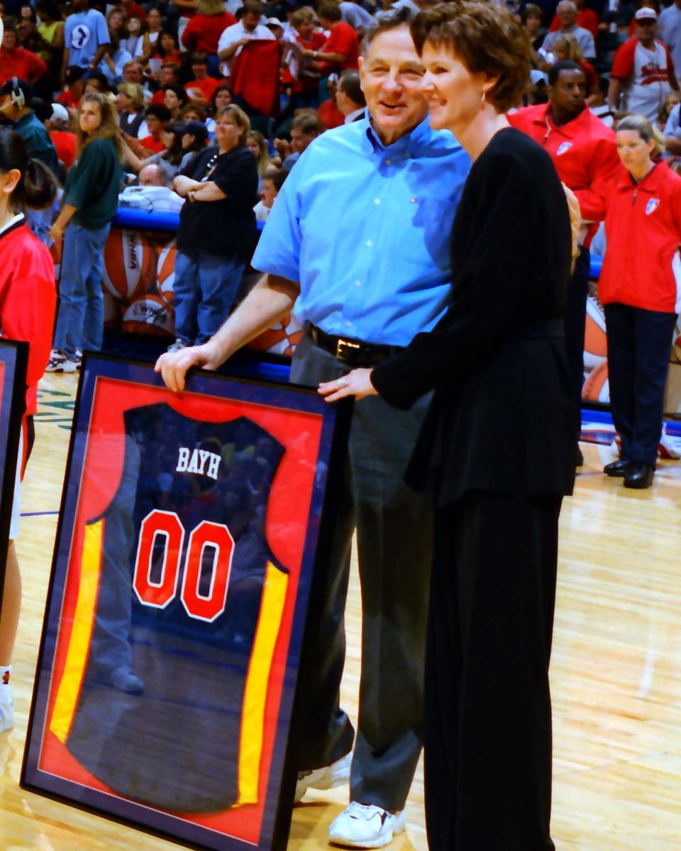 Kelly Krauskopf stands with former U.S. Sen. Birch Bayh at the inaugural Indiana Fever game in 2000.