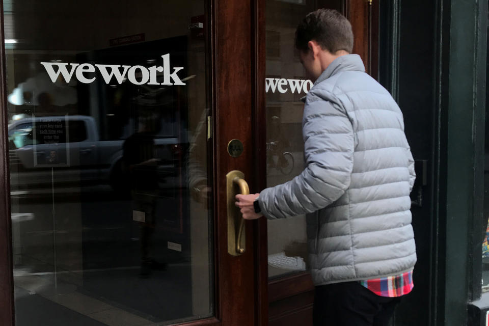 A man walks into a WeWork space in the Manhattan borough of New York City, New York, U.S., October 4, 2019. REUTERS/Carlo Allegri