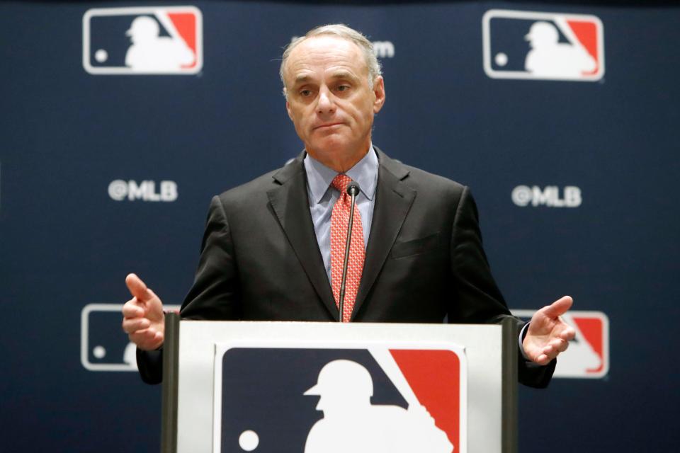 Rob Manfred speaks to the media at the owners meeting in 2019.