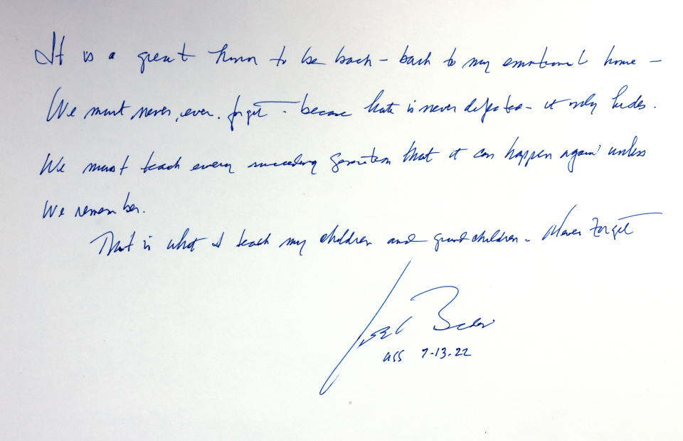 This picture shows a note written and signed by US President Joe Biden after his visit tot the Hall of Remembrance of the Yad Vashem Holocaust Memorial Museum, in Jerusalem, Wednesday July 13, 2022. (Menahem Kahana/Pool via AP)