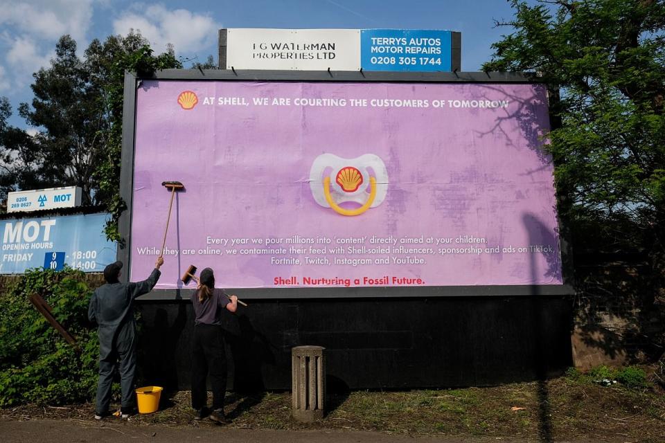 Activists put up Camille Aboudaram's satirical billboard.