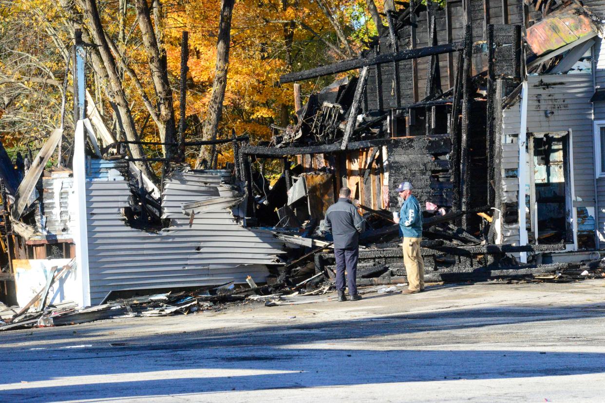 Investigators examine the site of a plane crash in Keene, N.H. on Saturday, Oct. 22, 2022. 