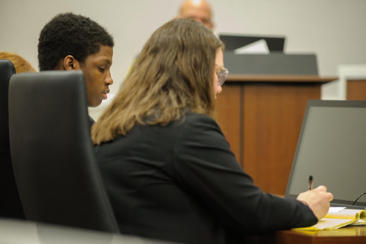 Khalil Perry watches his attorney Nicole M. Ostrowski as she takes notes during his sentencing hearing Friday, June 30. Perry, 16, was sentenced to 12 years in prison, eight more on extended supervision, and two concurrent
10-year probation terms Friday after he carjacked an 87-year-old woman at knifepoint outside the Waukesha Public Library on Nov. 30, 2021. He was convicted at trial last month of carjacking, kidnapping and armed robbery,
but the jury deadlocked on the sexual assault charge against him, leading to a mistrial being declared on that count.