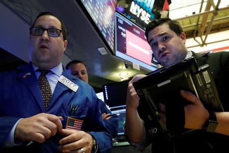 Traders work on the floor of the New York Stock Exchange (NYSE) in New York, U.S., April 27, 2017. REUTERS/Brendan McDermid