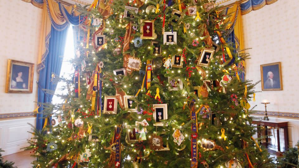 <strong>2011: </strong>Obama's theme "Shine, Give, Share" honored military families with ornaments made by them. - Charles Dharapak/AP