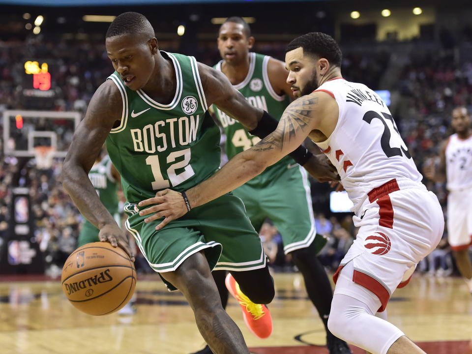 Boston Celtics guard Terry Rozier (12) moves past Toronto Raptors guard Fred VanVleet (23) during second-half NBA basketball game action in Toronto, Friday, Oct. 19, 2018. (Frank Gunn/The Canadian Press via AP)