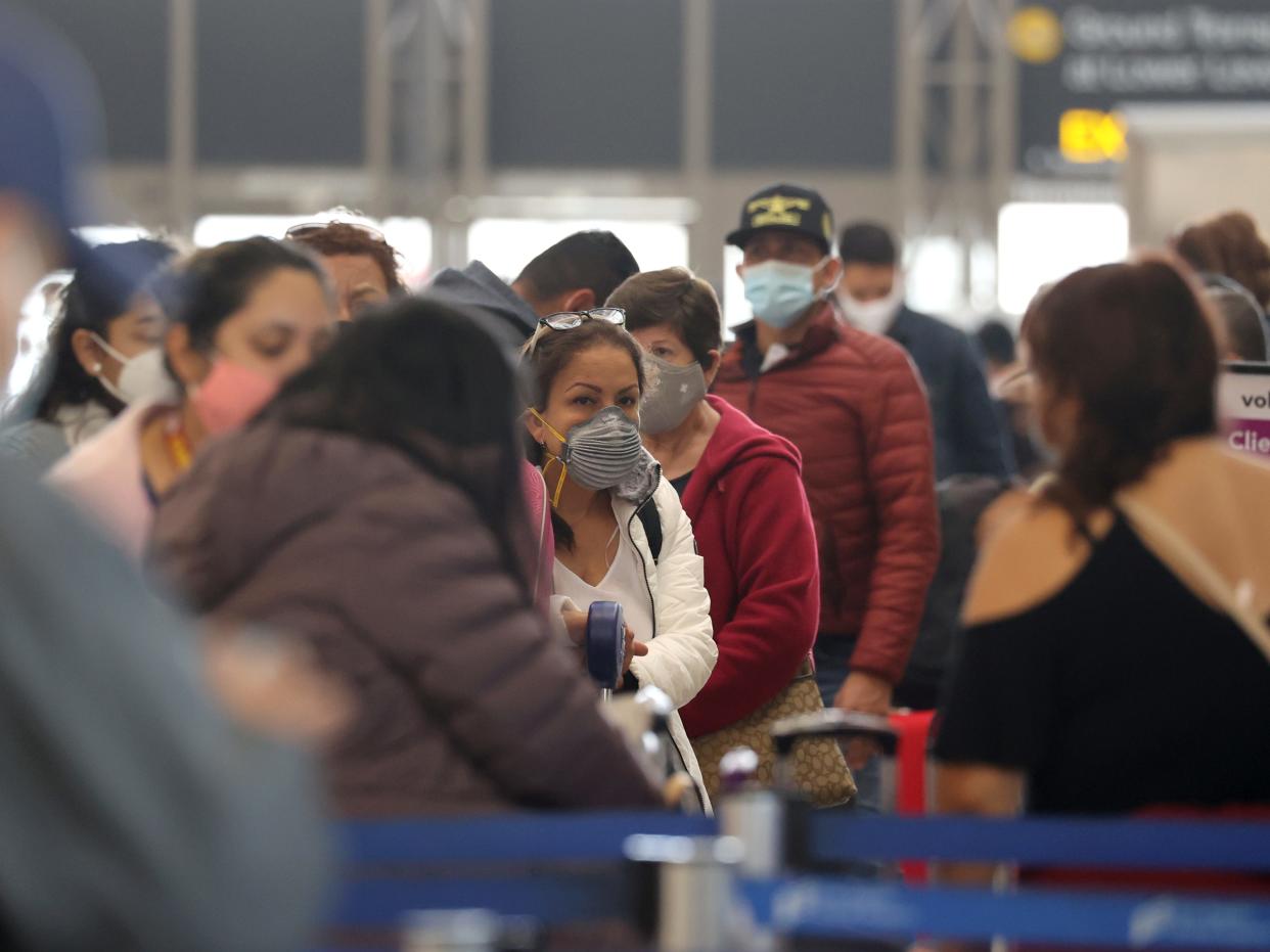 Passengers wait to check in at Tom Bradley international terminal at LAX airport, as the global outbreak of the coronavirus disease (COVID-19) continues, in Los Angeles, California, U.S., November 23, 2020.