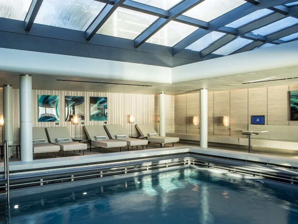 indoor pool under a ceiling of windows