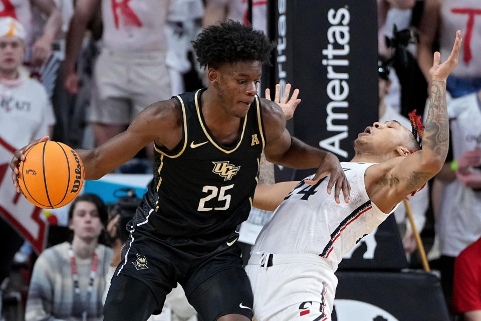 UCF's Taylor Hendricks dribbles the ball against Cincinnati during a game in February. (Dylan Buell/Getty Images)