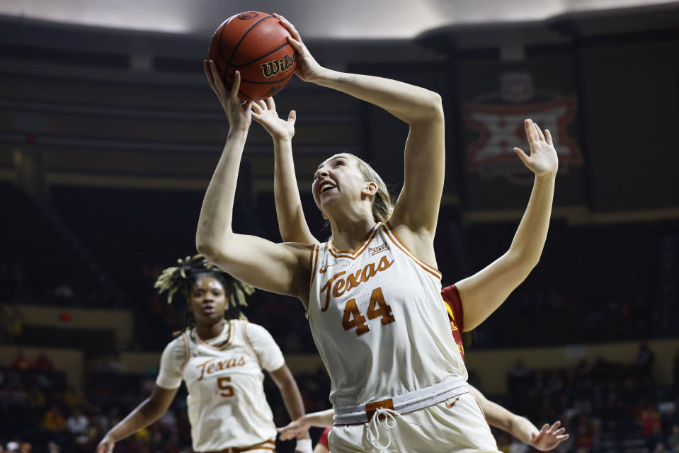 Texas forward Taylor Jones (44) scores against Iowa State during the first half of the NCAA college basketball championship game of the Big 12 Conference tournament, Sunday, March 12, 2023, in Kansas City, Mo. (AP Photo/Colin E. Braley)