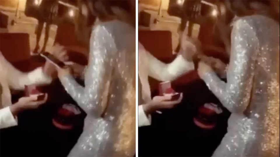 Groom grabs phone from fiance's hand during proposal