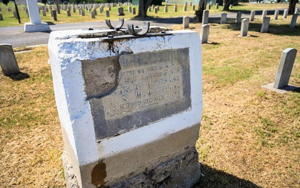 A damaged plaque is shown in the Civil War section of the Veterans Liberty Cemetery in Fresno on Friday, April 28, 2023.