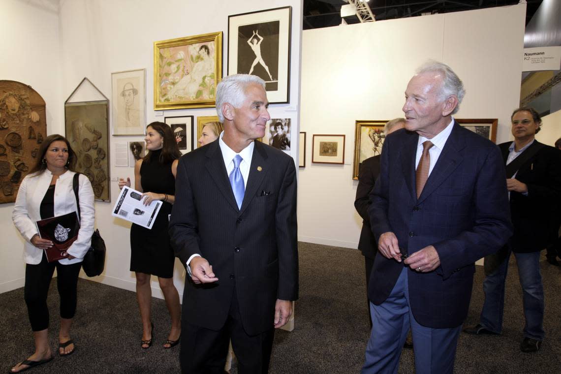 Florida Gov. Charlie Crist walks through Art Basel with Norman Braman on the opening day of the fair at the Miami Beach Convention Center in December 2007. CHARLES TRAINOR JR