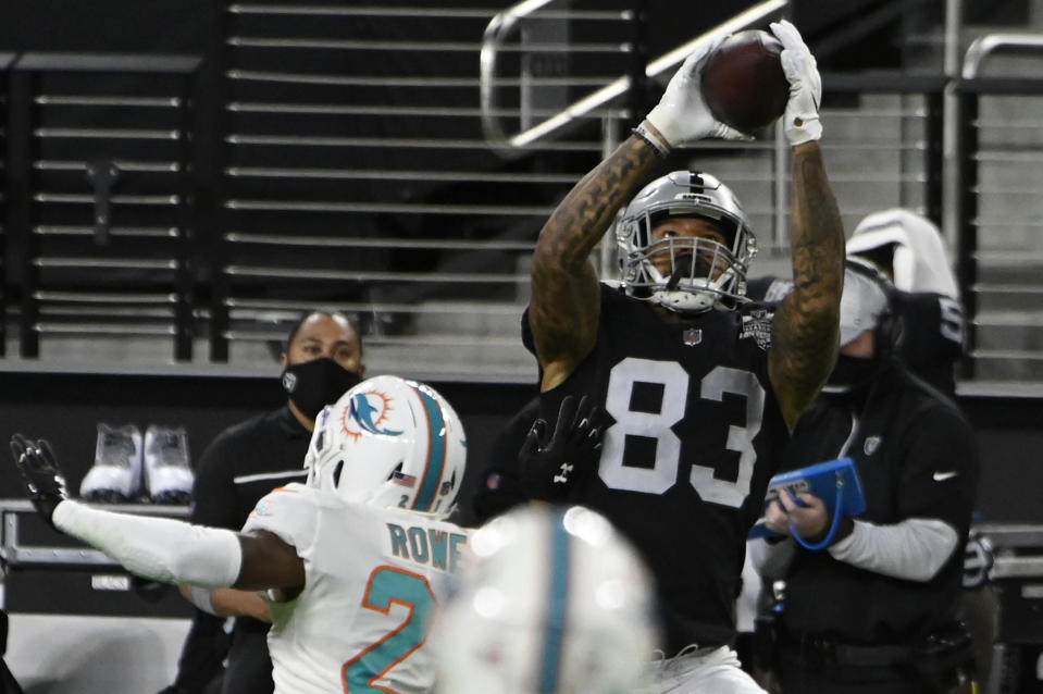 Las Vegas Raiders tight end Darren Waller (83) makes a reception against the Miami Dolphins during the first half of an NFL football game, Saturday, Dec. 26, 2020, in Las Vegas. (AP Photo/David Becker)