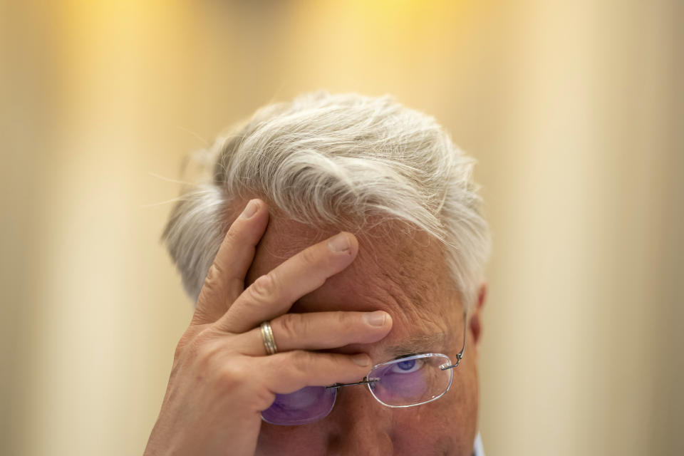 Associate Pronouncer Brian Sietsema listens to a debate over proposed word definitions and sentence use during a pre-bee meeting of the word panel to finalize the 2023 Scripps National Spelling Bee words on Sunday, May 28, 2023, at National Harbor in Oxon Hill, Md. (AP Photo/Nathan Howard)