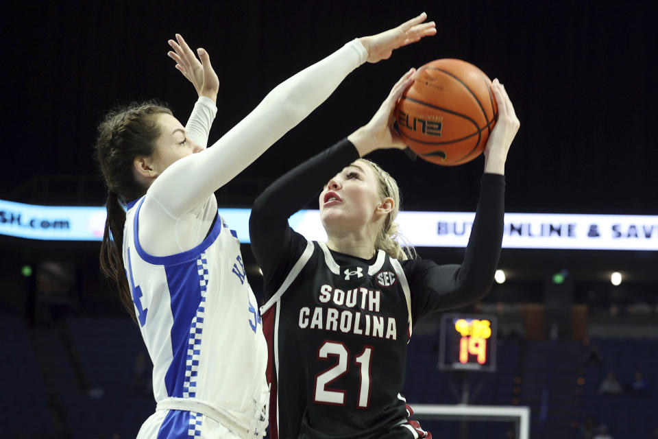 South Carolina's Chloe Kitts (21) looks to shoot while defended by Kentucky's Emma King, left, during the second half of an NCAA college basketball game Sunday, Feb. 25, 2024, in Lexington, Ky. (AP Photo/James Crisp)