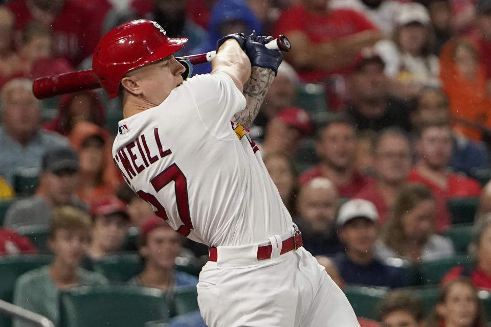 St. Louis Cardinals' Tyler O'Neill follows through on a two-run single during the first inning of a baseball game against the Chicago Cubs Friday, Sept. 2, 2022, in St. Louis. (AP Photo/Jeff Roberson)