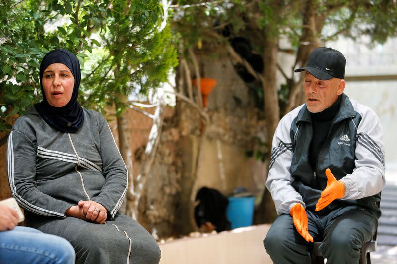 Parents of Hamza al-Masri, a Palestinian prisoner held in an Israeli jail, are seen during an interview with Reuters, in Bethlehem in the Israeli-occupied West Bank