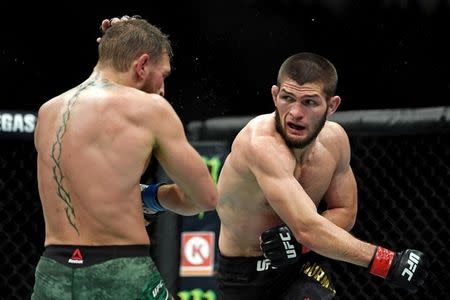 FILE PHOTO: Oct 6, 2018; Las Vegas, NV, USA; Khabib Nurmagomedov (red gloves) fights Conor McGregor (blue gloves) during UFC 229 at T-Mobile Arena. Mandatory Credit: Stephen R. Sylvanie-USA TODAY Sports