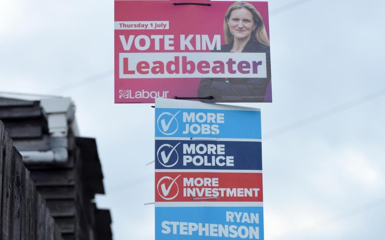 Posters for the Labour candidate, Kim Leadbeater, and the Conservative candidate, Ryan Stephenson, in Batley and Spen - Asadour Guzelian/ Guzelian