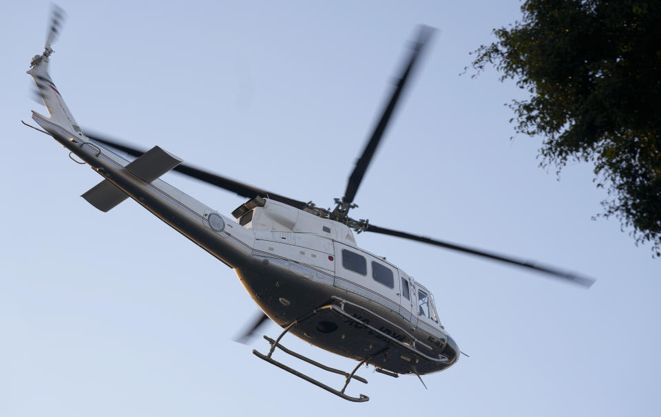 A government helicopter takes off from the prosecutor's building where Ovidio Guzmán, one of the sons of former Sinaloa cartel boss Joaquin "El Chapo" Guzmán, is in custody in Mexico City, Thursday, Jan. 5, 2023. The Mexican military has captured Ovidio Guzman during a operation outside Culiacan, a stronghold of the Sinaloa drug cartel in western Mexico. (AP Photo/Fernando Llano)