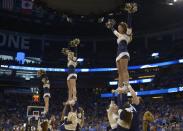 The Pittsburgh cheerleaders perform during the first half in a third-round game in the NCAA college basketball tournament against Florida, Saturday, March 22, 2014, in Orlando, Fla. (AP Photo/Phelan M. Ebenhack)