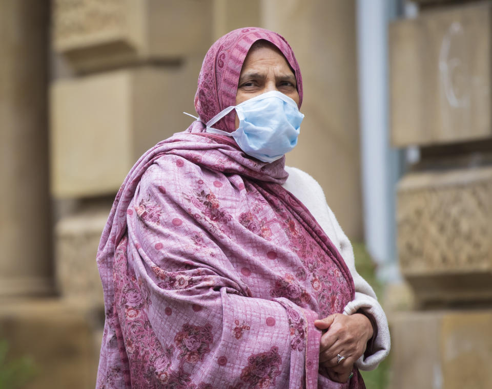 A member of the public wears a face mask in, Bradford in Yorkshire, after Health Secretary Matt Hancock published a new review which found black, Asian and minority ethnic (BAME) people are at significantly higher risk of dying from Covid-19. (Photo by Danny Lawson/PA Images via Getty Images)