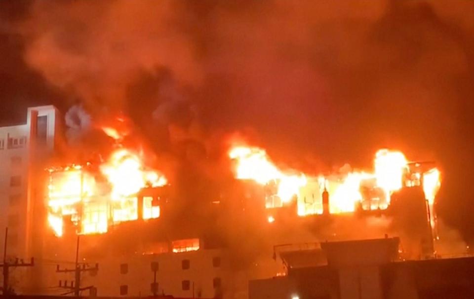 In this image from video provided by Fresh News, fire engulfs part of the Grand Diamond City casino and hotel in the town of Poipet (AP)