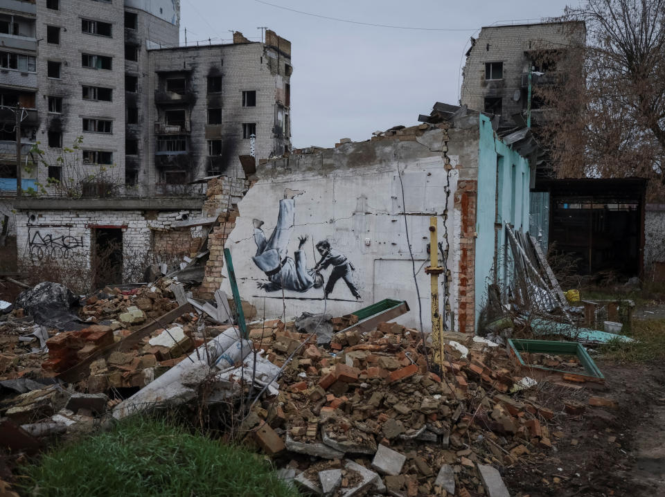 A new graffiti in Banksy's signature style, although not posted by the mercurial artist on social media, is seen at the wall of destroyed building in the Ukrainian town of Borodianka, which had been occupied by Russia until April and heavily damaged by fighting in the early days of Russian invasion, November 12, 2022.  REUTERS/Gleb Garanich