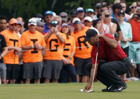 Mar 11, 2018; Palm Harbor, FL, USA; Tiger Woods lines up his putt on the 13th during the final round of the Valspar Championship golf tournament at Innisbrook Resort - Copperhead Course. Jasen Vinlove-USA TODAY Sports