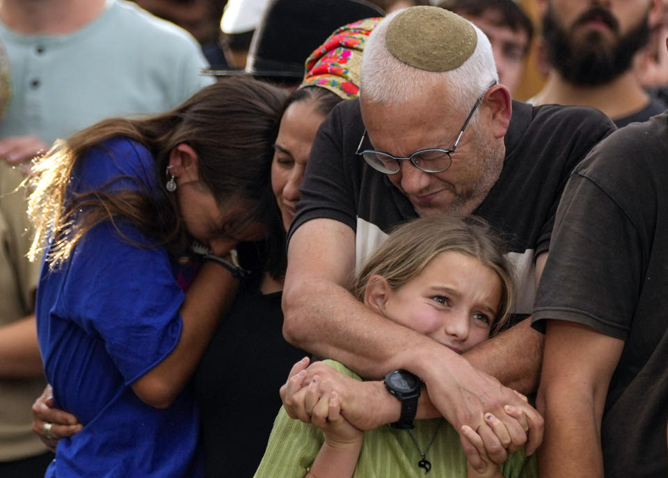 Family members mourn during the funeral of Israeli soldier Shilo Rauchberger at the Mount Herzl cemetery in Jerusalem, Israel, Thursday, Oct. 12, 2023. (AP Photo/Francisco Seco)