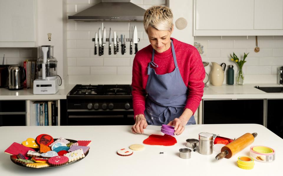 Carol Dean rolls pastry in her kitchen